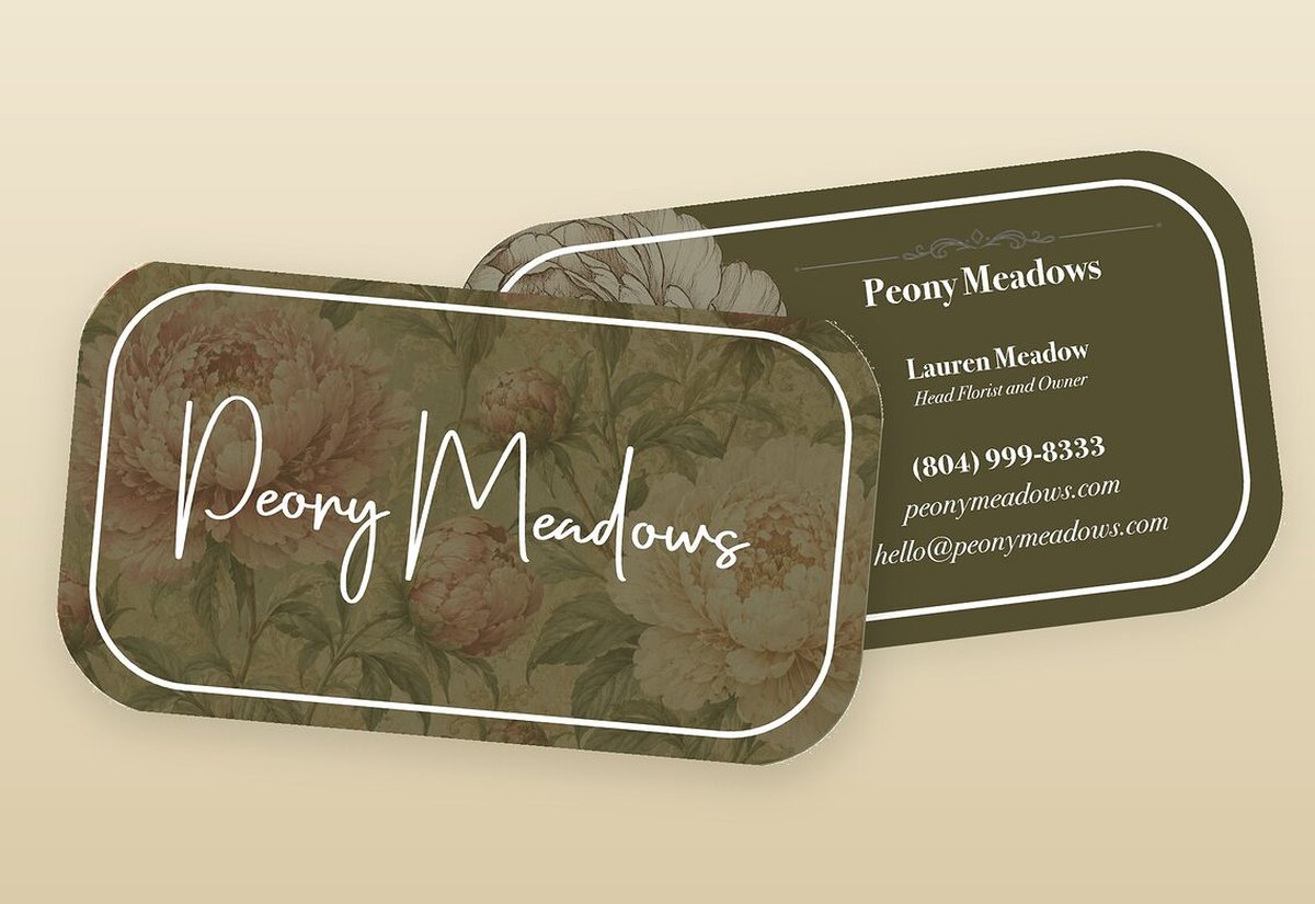 The Peony Meadows script wordmark carried across business cards, one mark repeated on every piece
