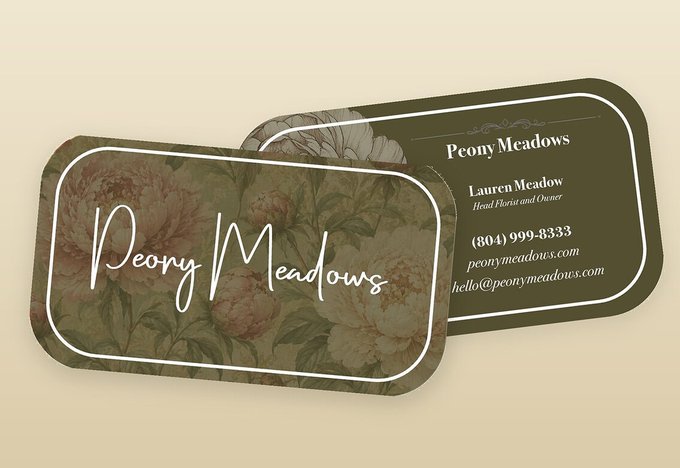 The Peony Meadows script wordmark carried across business cards, one mark repeated on every piece